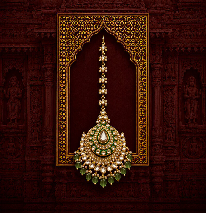 Close-up of various gold and pearl jewelry pieces elegantly arranged in a red velvet box offering a luxurious display.